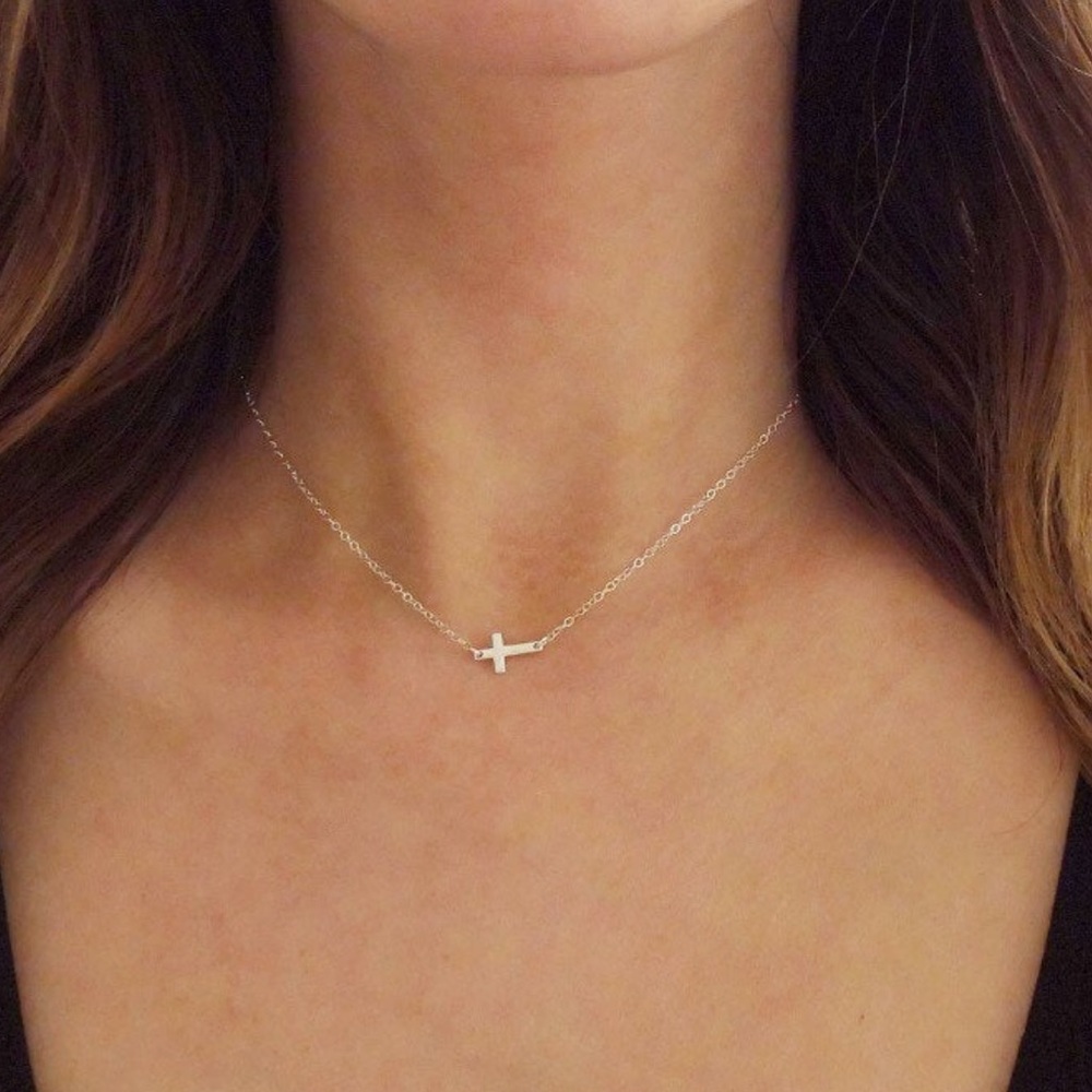Sterling silver sideways cross necklace.